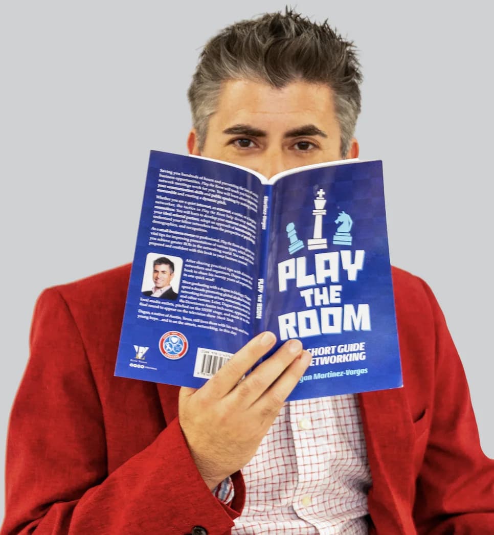 Dagan Martinez-Vargas holding his book Play the Room