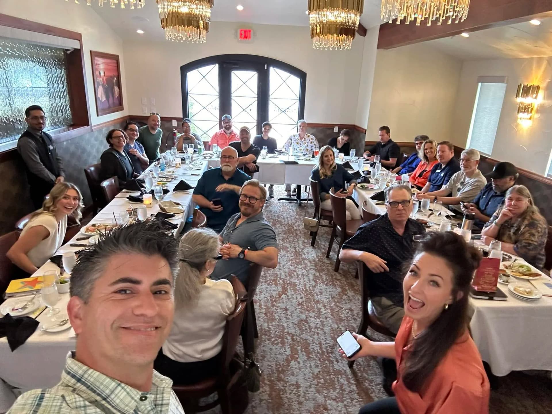 Dagan Martinez-Vargas with a full room of attendees at a Play the Room networking event