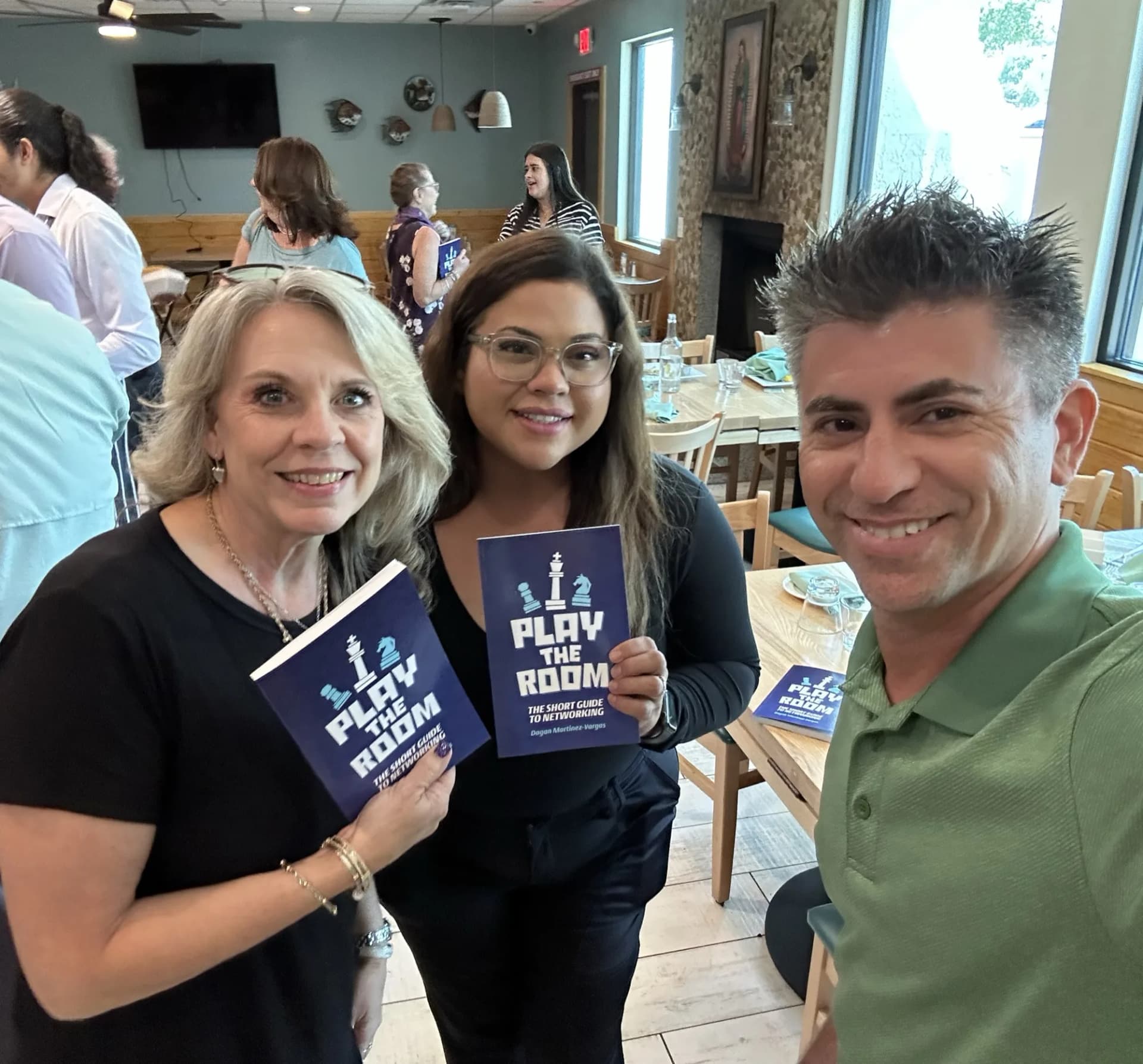 Dagan with a reader at a networking event